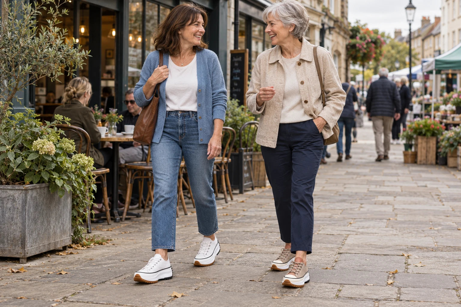 Two women walking together in Serena sneakers